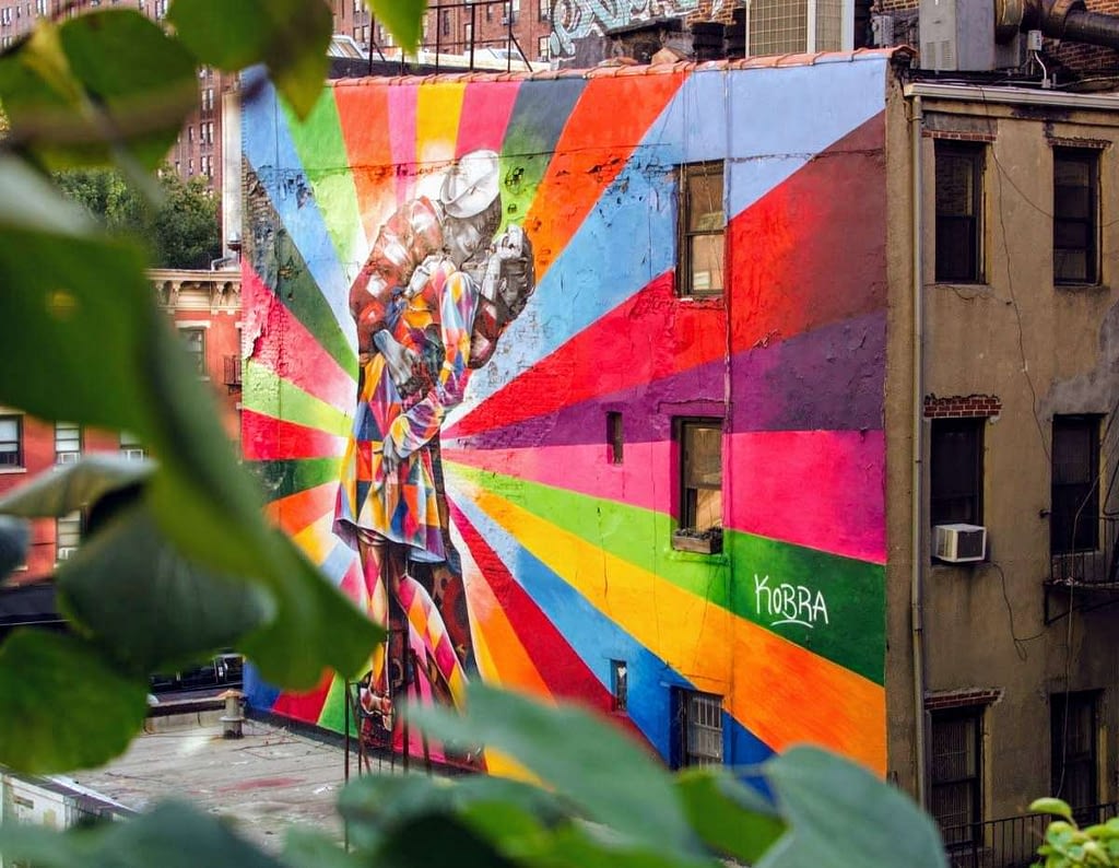 A colorful rendition of The Kiss – large street art mural by Eduardo Kobra - located near West 23rd Street in New York city.