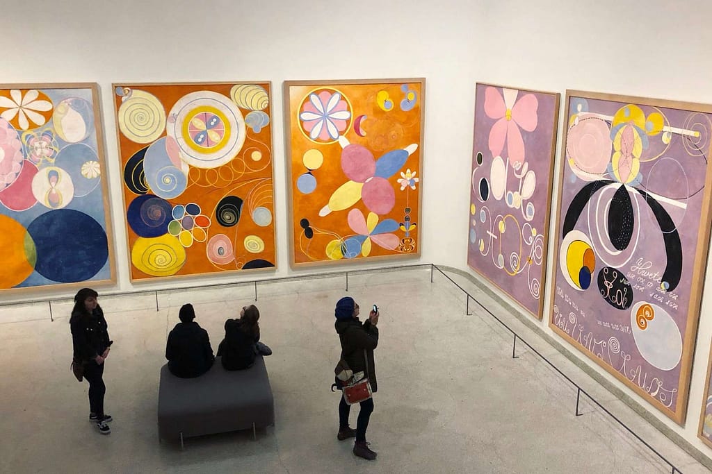 Several colorful murals of Hilma af Klint on display at a Guggenheim gallery. 